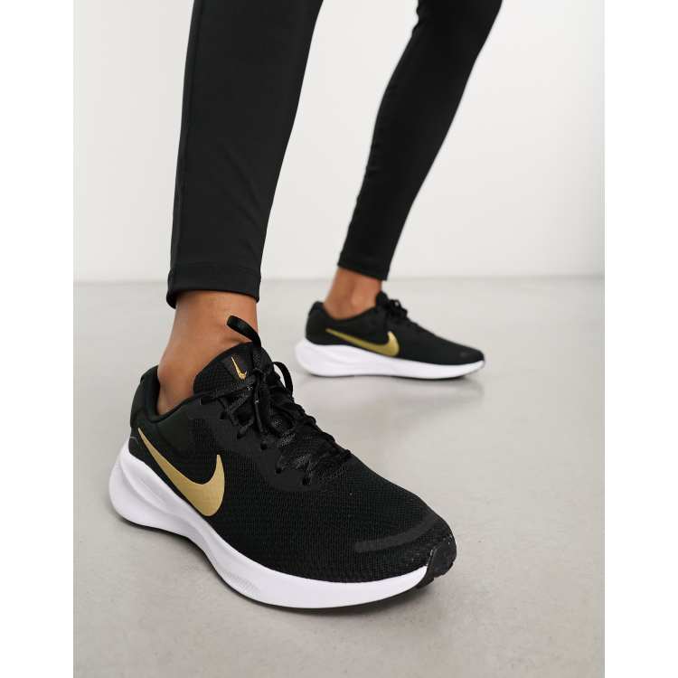 Nike Running Revolution 7 trainers in black and gold