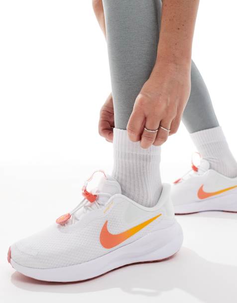 Nike Running Revolution 7 trainers in white and pink - view 1