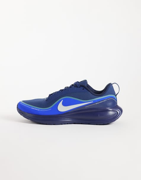 Nike Running Revolution 8 Utility trainers in white & blue - view 1