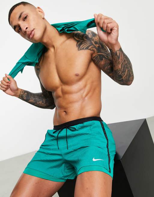 green nike running shorts