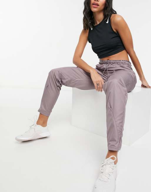 Nike track pants online purple