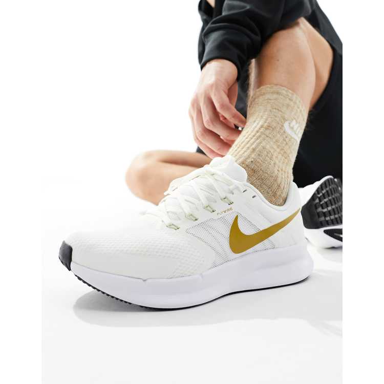 Nike Running Run Swift sneakers in white and gold