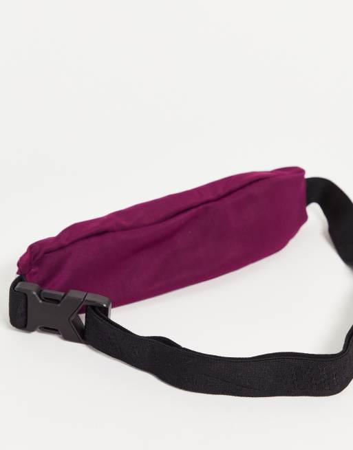 Nike Running Slim waistpack in purple ASOS