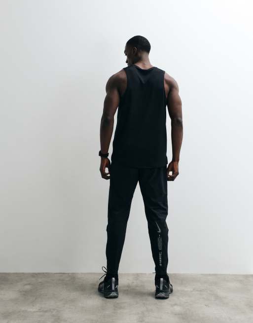 Nike Running Stride Dri-FIT woven trousers in black, 5 of 5