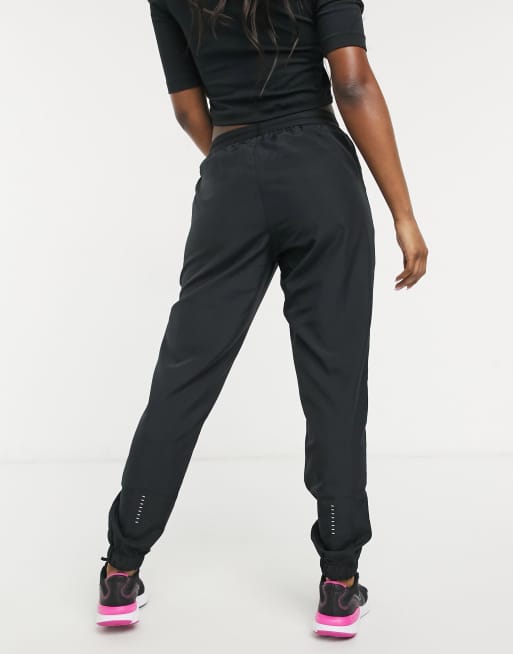 Nike swoosh store track pants dames