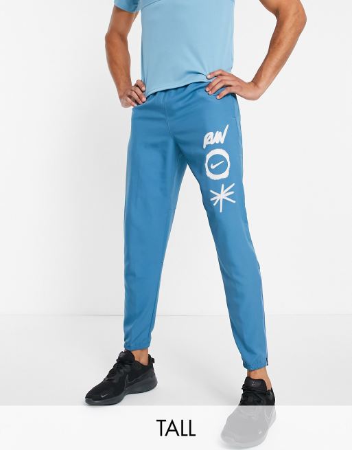 Nike Running Tall – Wild Run Challenger – Niebieskie joggersy z tkaniny