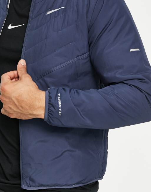 Nike Running Therma FIT rain repellent jacket in blue ASOS