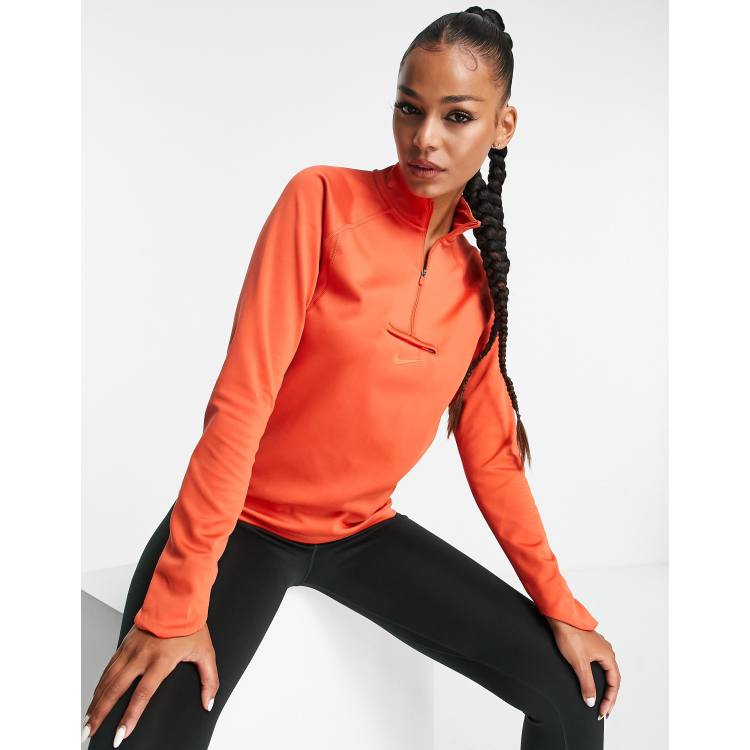 Nike Running Trail Dri-FIT midlayer half zip top in orange | ASOS