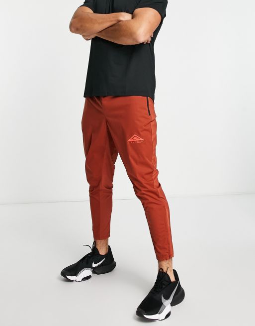 Nike Running – Trail Phenom Elite Dri-FIT – Jogginghose in Dunkelorange