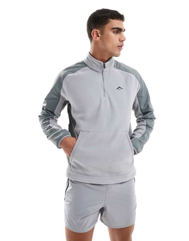Nike Running Trail Polartec 1/4 zip fleece in grey | ASOS