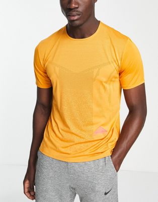 Nike Running Trail Rise 365 Dri-FIT t-shirt in mustard