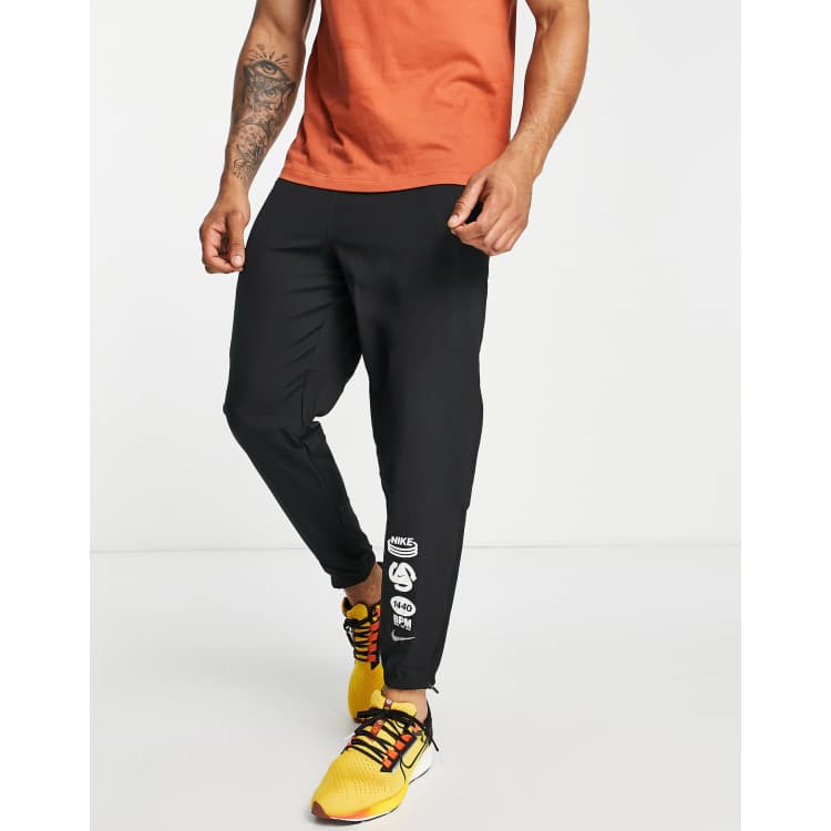 Nike running woven joggers in online black