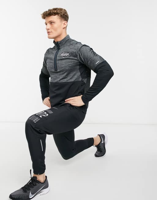Nike Running Wild Run Element 1/4 zip top in black | ASOS