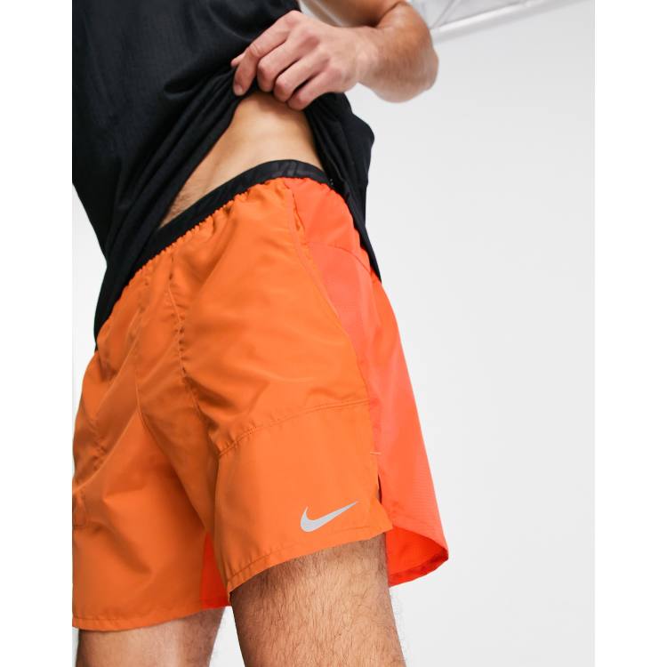 Nike Running Wild Run Flex Stride 7 inch short in orange ASOS