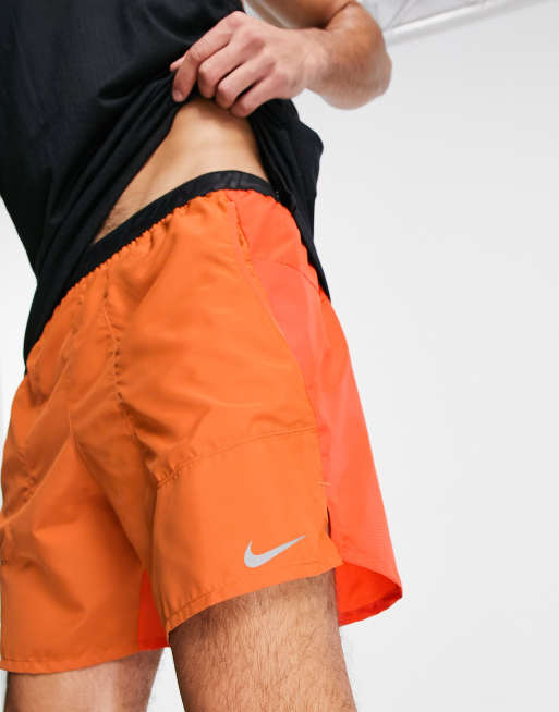 Nike Running Wild Run Flex Stride 7 inch short in orange ASOS