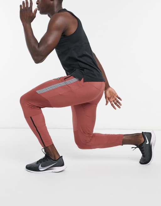 Nike Running Wild Run Phantom joggers in red