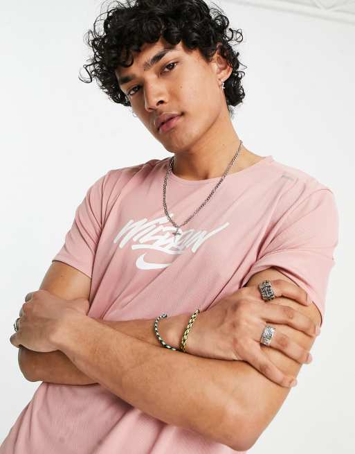 Pink and gold nike shirt on sale