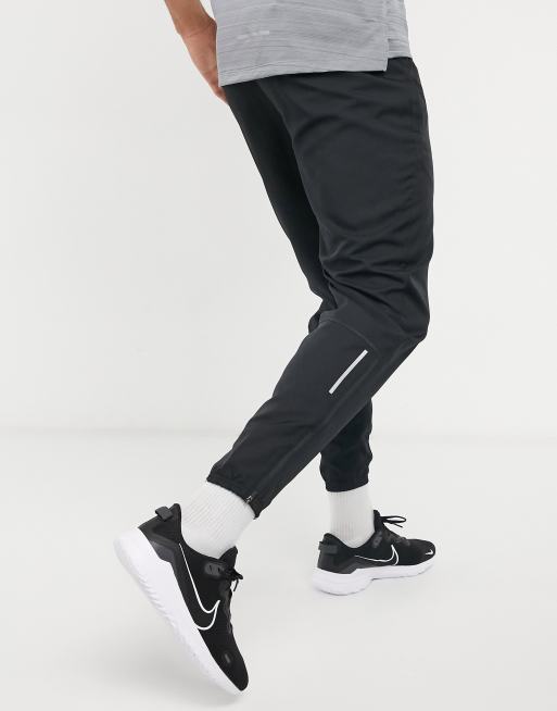 Nike Running woven joggers in black