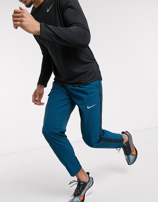 Nike Running woven joggers in blue