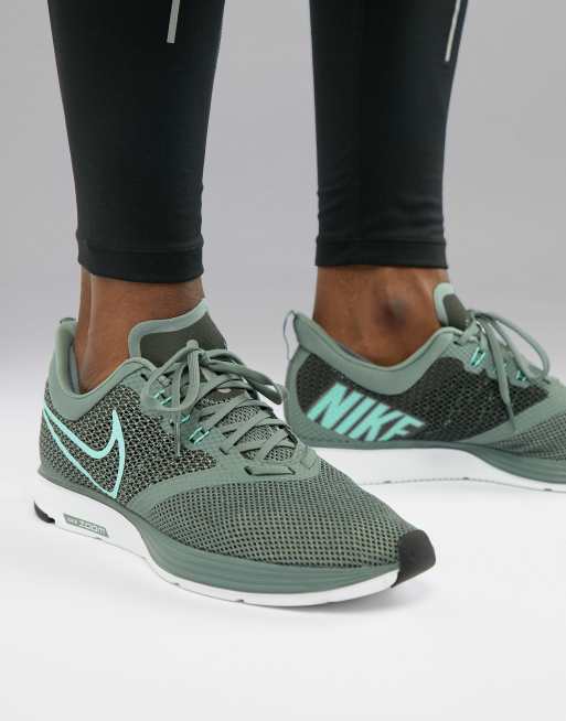 grey and green nike trainers