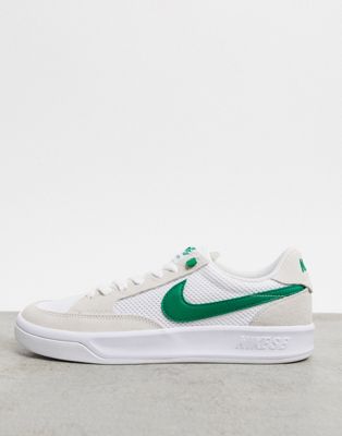 white and green nike trainers