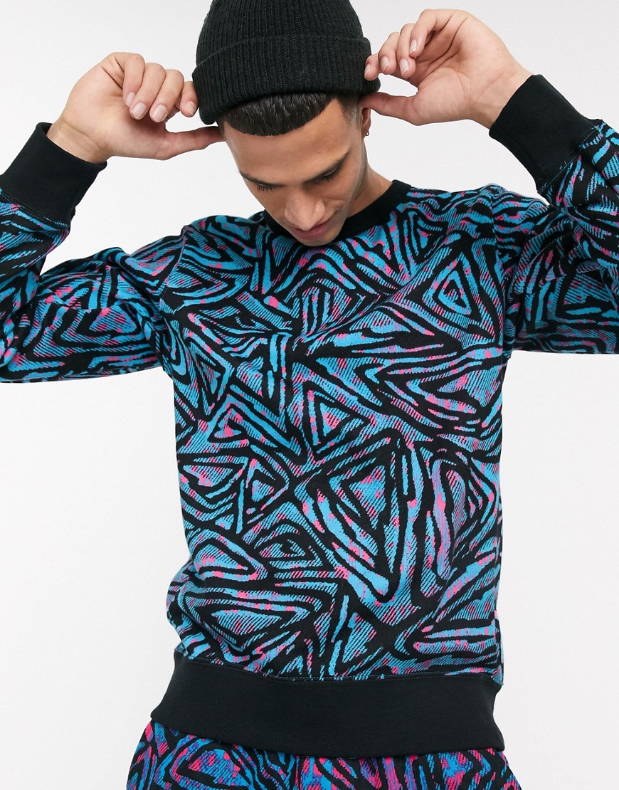 Nike SB – Blå sweatshirt med rund halsringning och heltäckande mönster