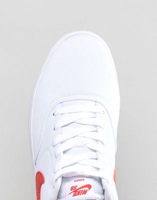 white nike shoes with red check