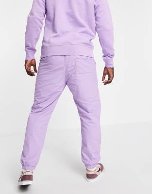 purple nike track pants