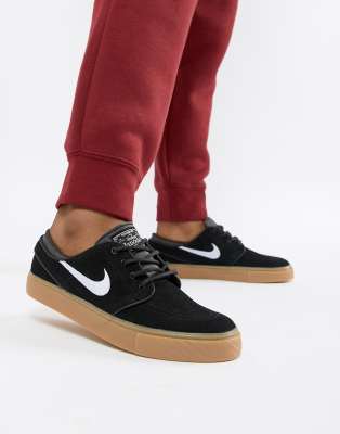 nike sb zoom janoski trainers in black with gum sole