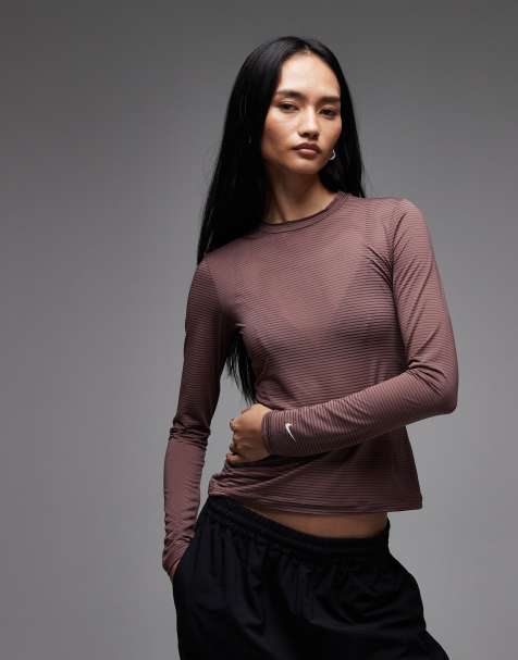Nike sheer longsleeve top in brown - view 1