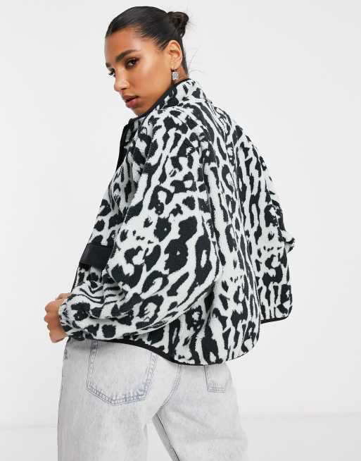 Nike sherpa animal print jacket in black white