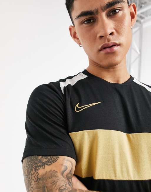 White black and gold best sale nike shirt