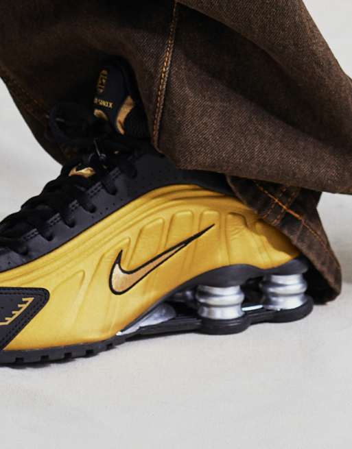 Nike shox nere oro online