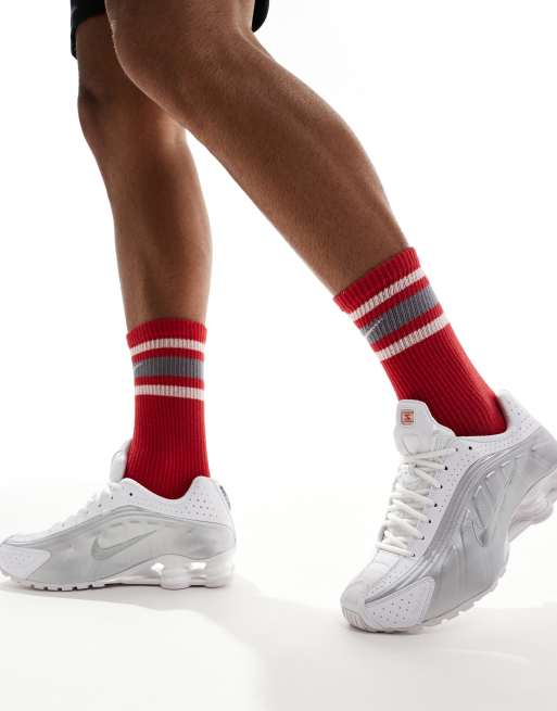 Nike Shox R4 trainers in white and metallic silver