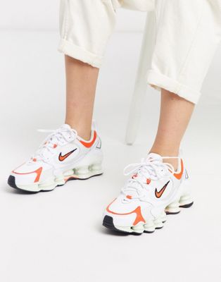 orange and white nike shoes