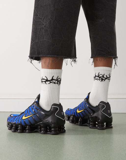 Nike Shox TL sneakers in black and blue