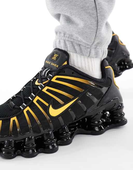 Nike Shox TL sneakers in black and orange | ASOS