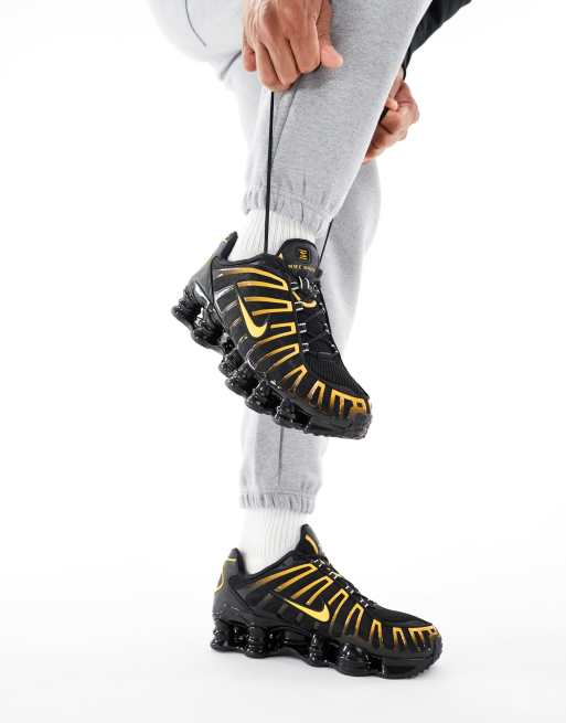 Nike Shox TL sneakers in black and orange | ASOS