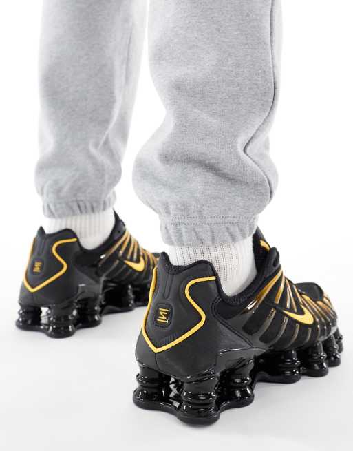 Nike Shox TL sneakers in black and orange