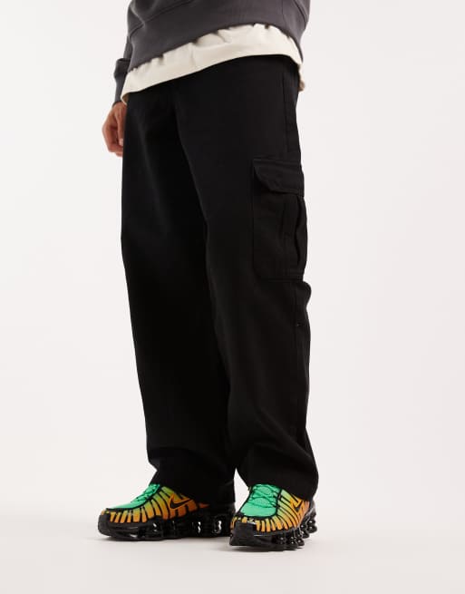 Nike Shox TL sneakers in black, green and orange | ASOS