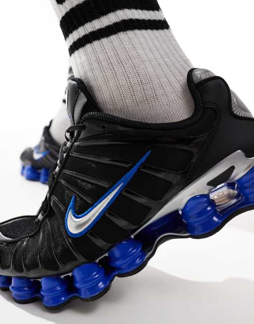 Nike Shox TL trainers in black and metallic silver 