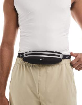 Nike Running Nike slim waistpack in black and silver