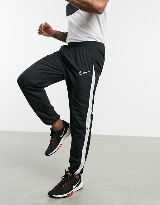 Nike Soccer academy sweatpants with side stripe in black | ASOS