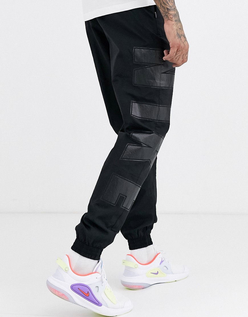 Nike Social Currency logo cuffed joggers in black