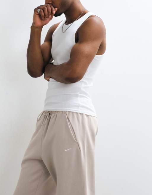 Nike Solo Fleece logo straight leg bungee joggers in light beige, 3 of 5