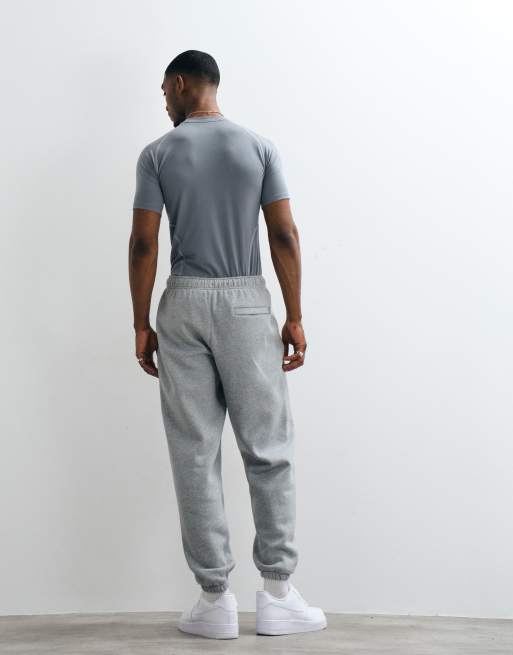 Nike Solo Fleece straight leg cuff joggers in light grey, 5 of 5