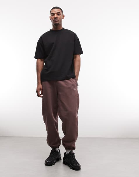 Nike Solo Swoosh cuffed sweatpants in brown - view 1