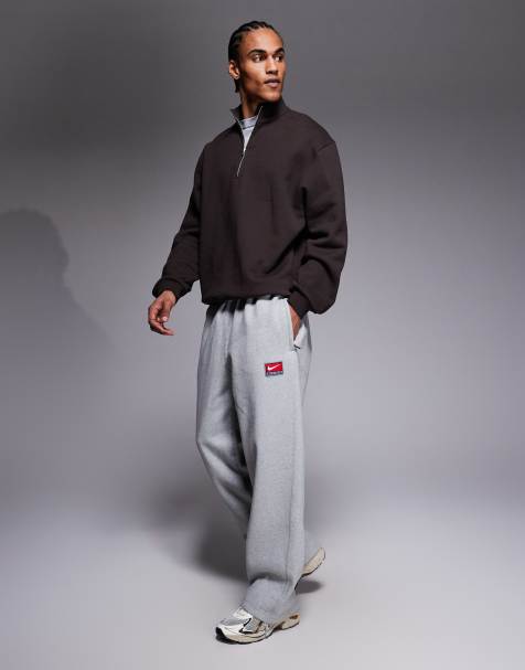 Nike Solo Swoosh sweatpants in gray - view 1