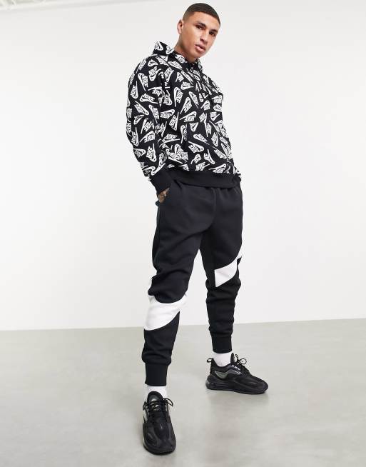 https://images.asos-media.com/products/nike-sport-essentials-all-over-logo-print-fleece-hoodie-in-black/200746387-4?$n_640w$&wid=513&fit=constrain