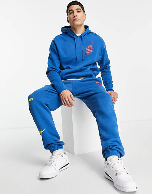 Nike Sport Essentials Multi Futura logo fleece joggers in marina blue | ASOS